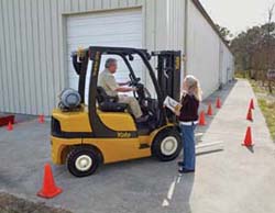 Operator being trained on working on a loading dock.